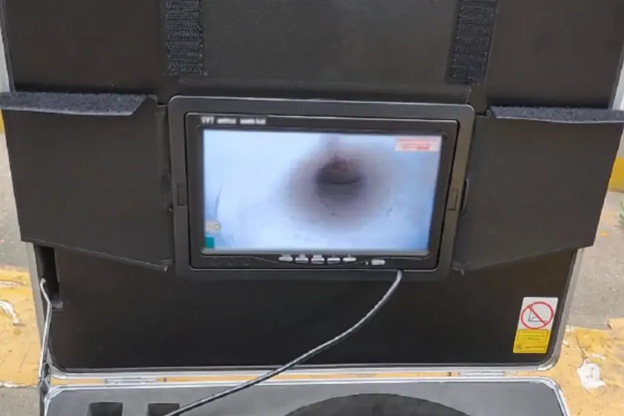 Sewer inspection camera monitor showing the inside of a pipe